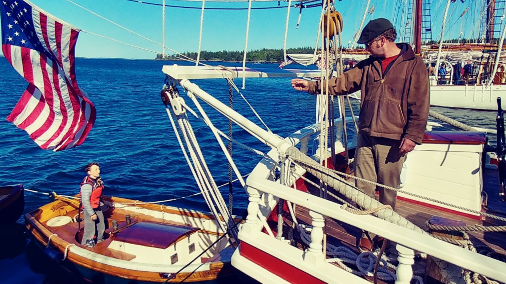 Captain Noah on Schooner Stephen Taber indicates to Oscar Barnes where to direct the yawl boat.