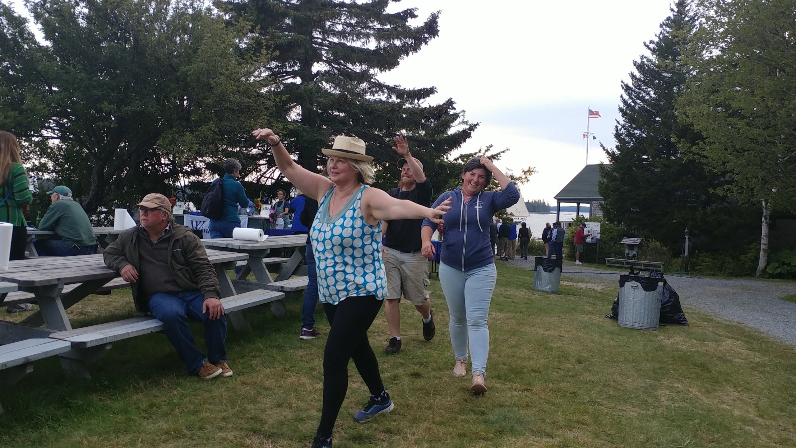 People dancing among the picnic tables to the tunes of Flash in the Pans Steel Drum Band at WoodenBoat Sail-In. 