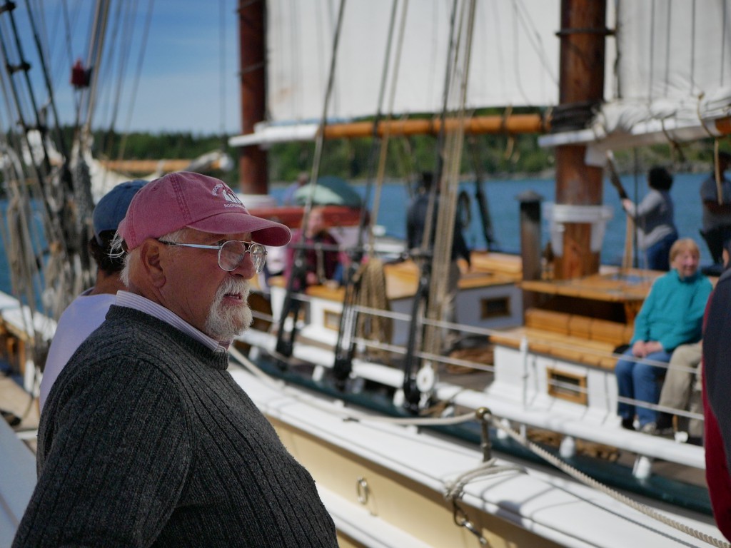 Captain Doug Lee on board the Schooner Herigage as another boat rafts up next to him. 