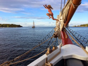 Girl jumps off the bow of a windjammer